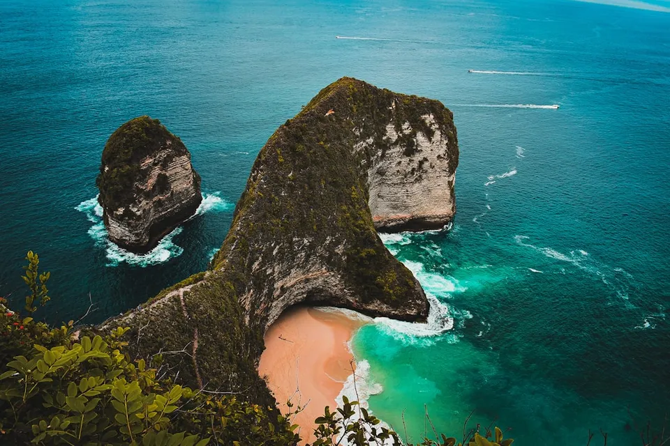 brown rock formation on sea shore during daytime