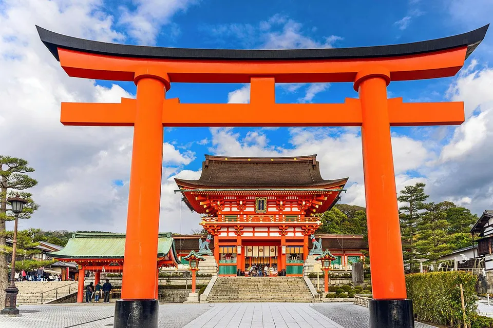 Fushimi Inari Shrine's iconic red torii gate on a day trip from Osaka.