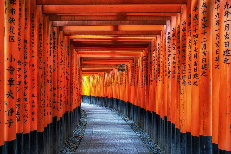 Pathway through red torii gates at Fushimi Inari Taisha Shrine, Kyoto.