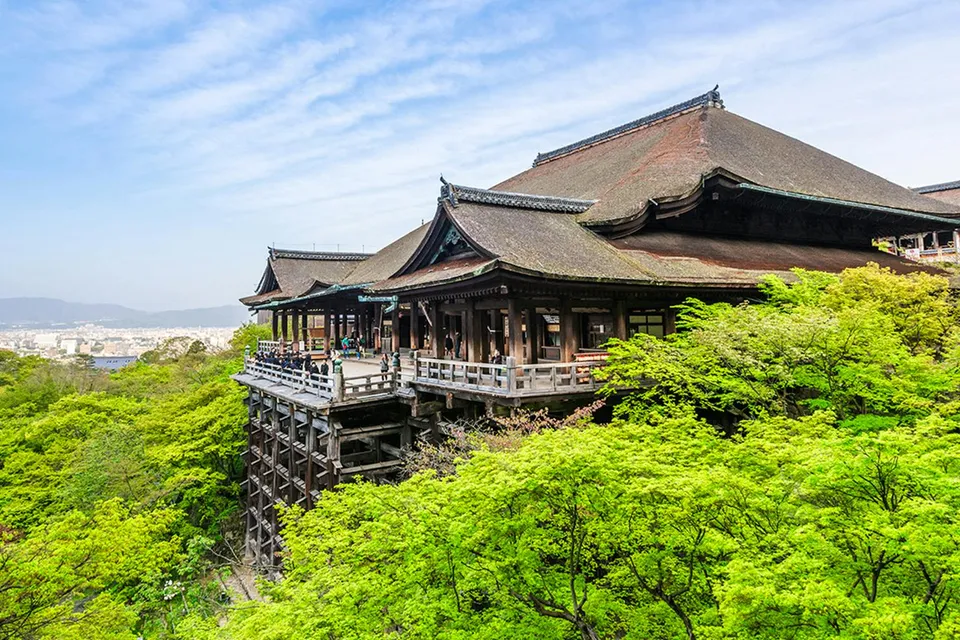 Kiyomizu-dera Temple surrounded by lush greenery on a day tour in Kyoto.