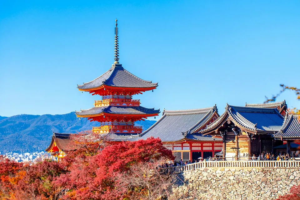Kyoto's Kiyomizu-dera Temple with autumn foliage, part of the Osaka to Kyoto Sagano Day Tour.