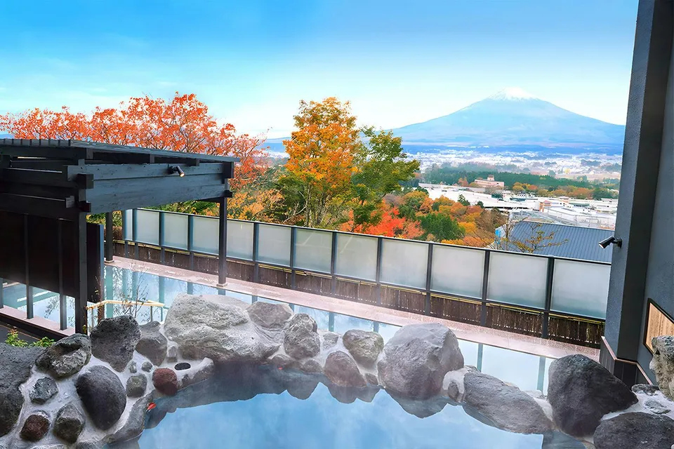 Konohananoyu hot springs with view of Mt. Fuji and autumn foliage.