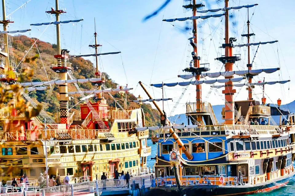 Hakone Pirate Ship on Lake Ashi, Japan, with scenic mountain backdrop.