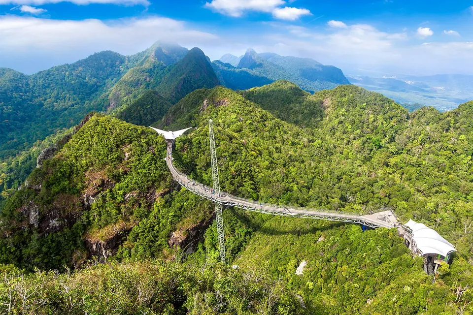 Langkawi SkyBridge spanning lush green mountains in Malaysia.