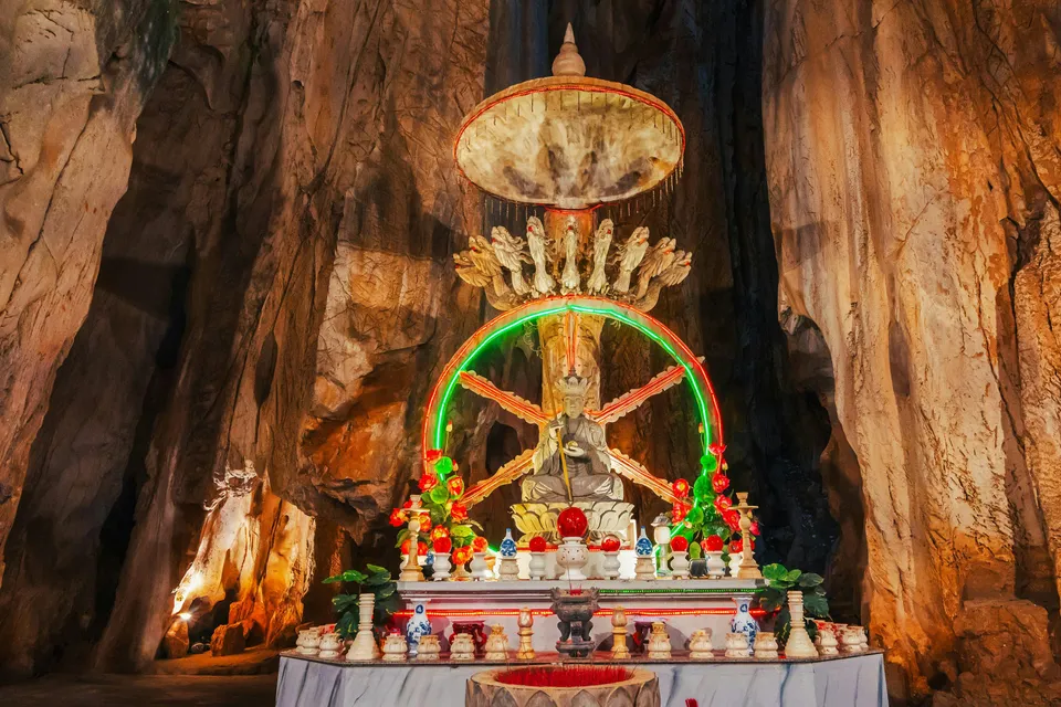 Altar with statue inside a cave at Sơn Trà Peninsula, Đà Nẵng, Vietnam.