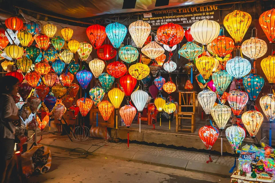 Hoi An night market with colorful traditional lanterns on display.