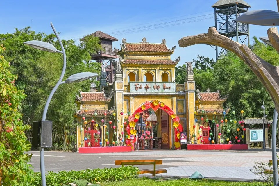 An ornate gate leads to a beautiful outdoor space