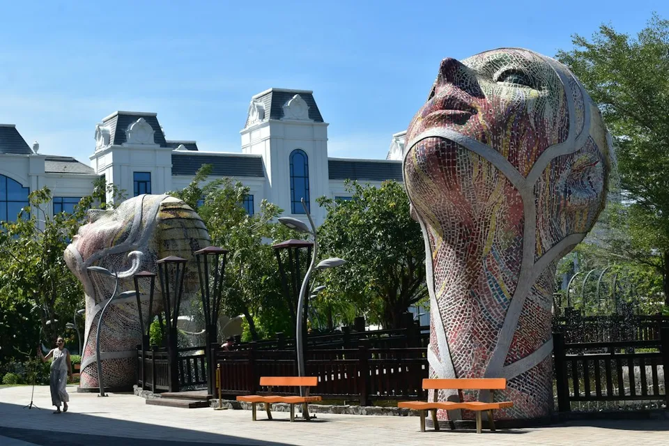 Giant abstract head sculptures in a park