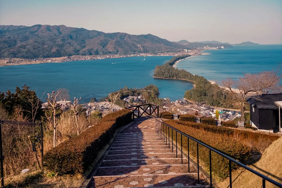 a view of the ocean from the top of a hill