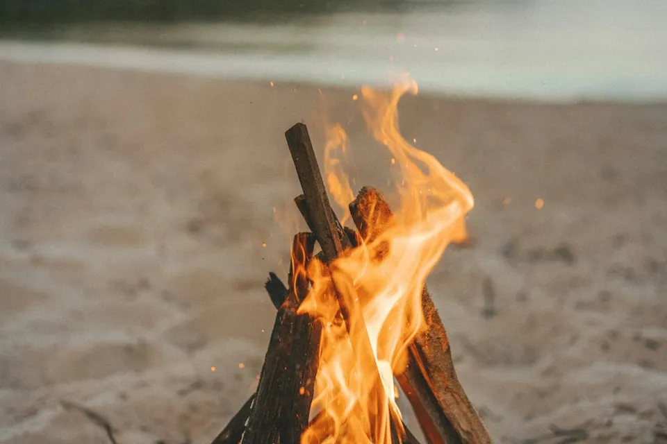 a bonfire on a beach
