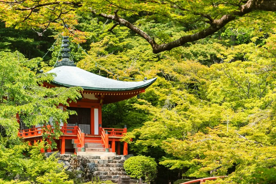 red temple near body of water