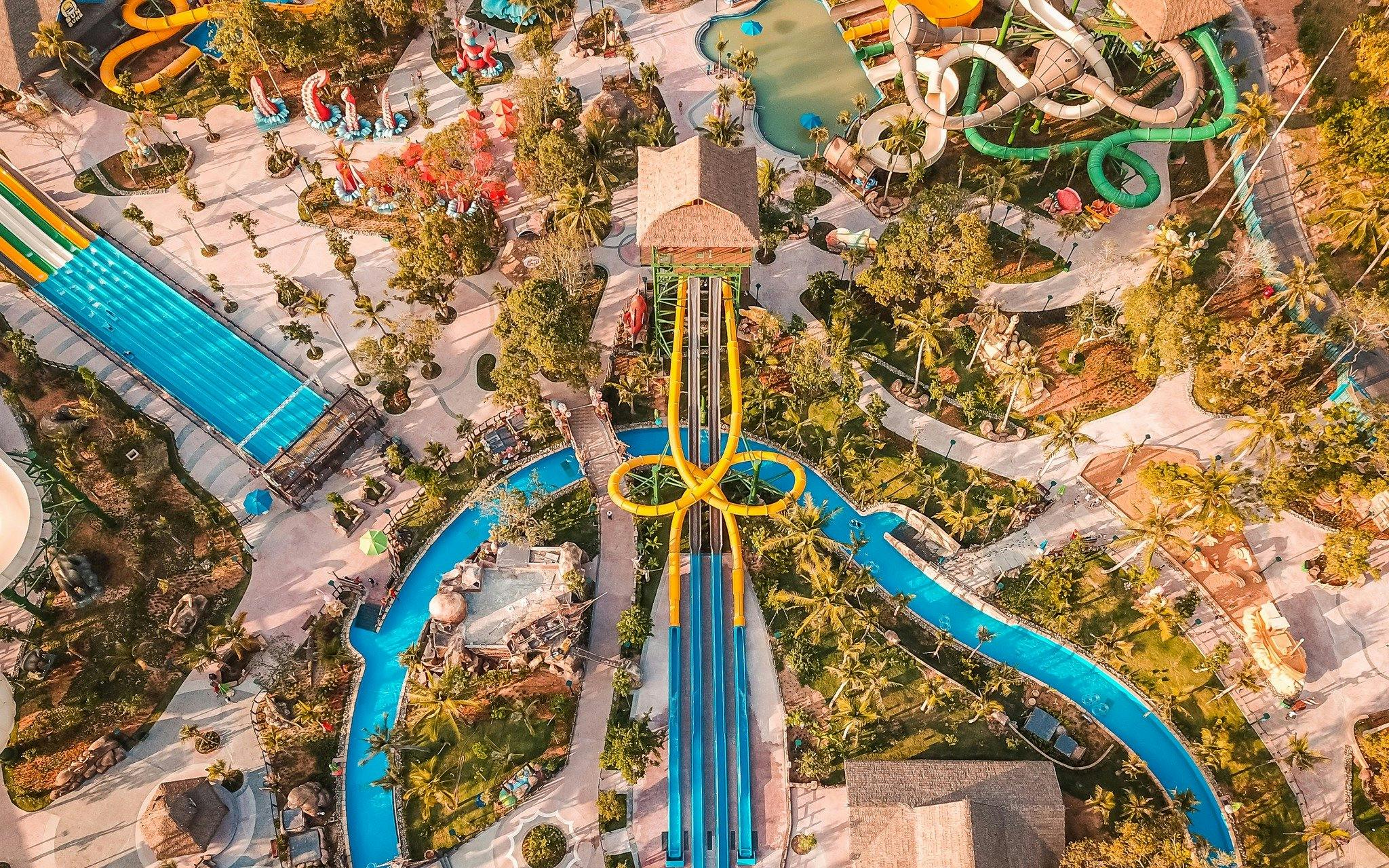 Aerial view of Aquatopia water park with slides and lazy river.