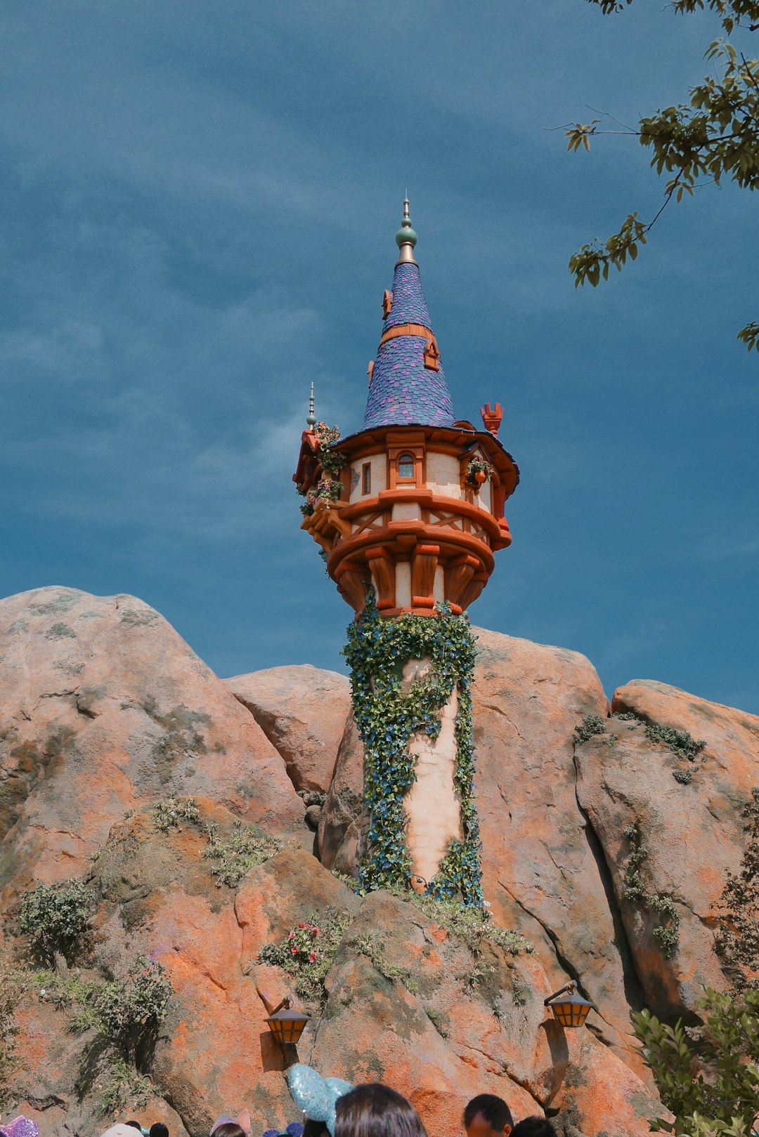 a group of people standing in front of a tower