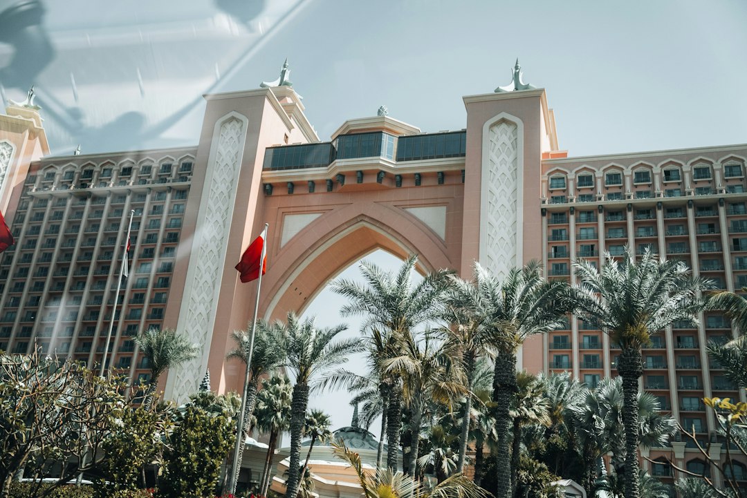 A large building with a clock tower in front of it