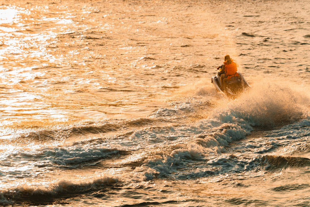 Person riding a jet ski on choppy water