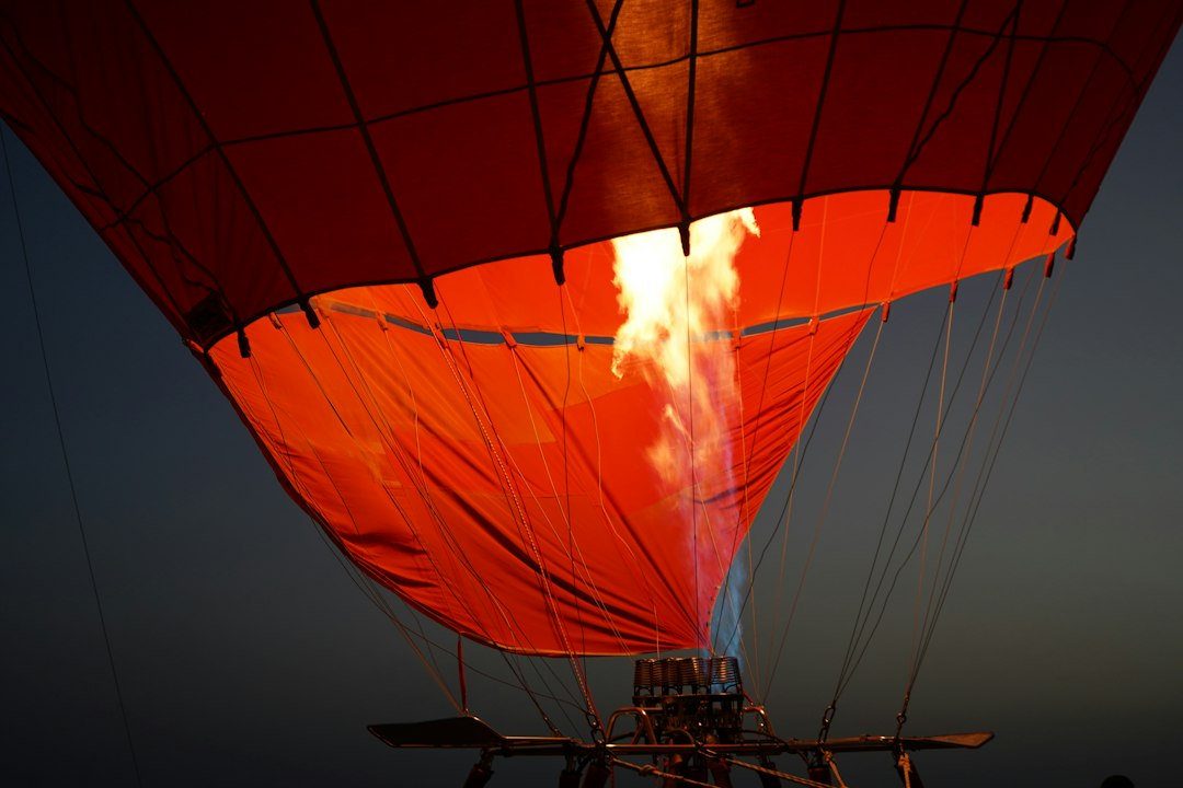 a hot air balloon with a flame coming out of it