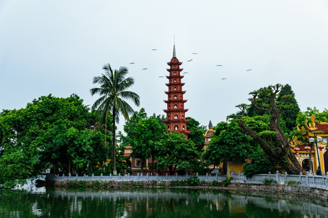 a tall tower sitting next to a body of water