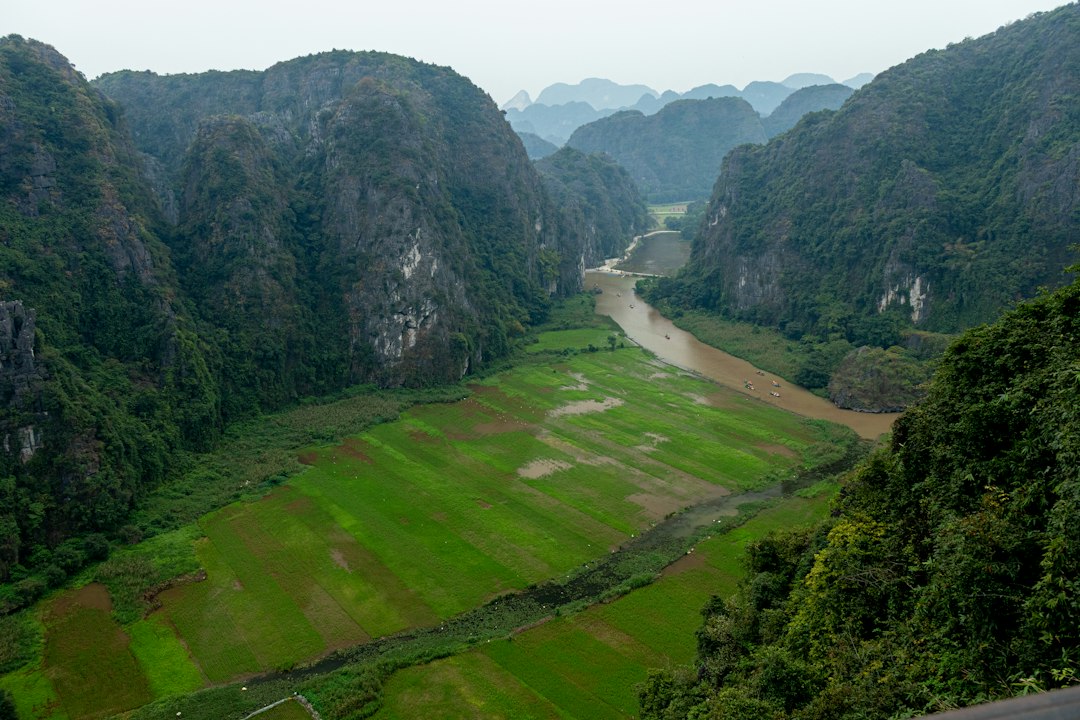 A valley surrounded by mountains with a river